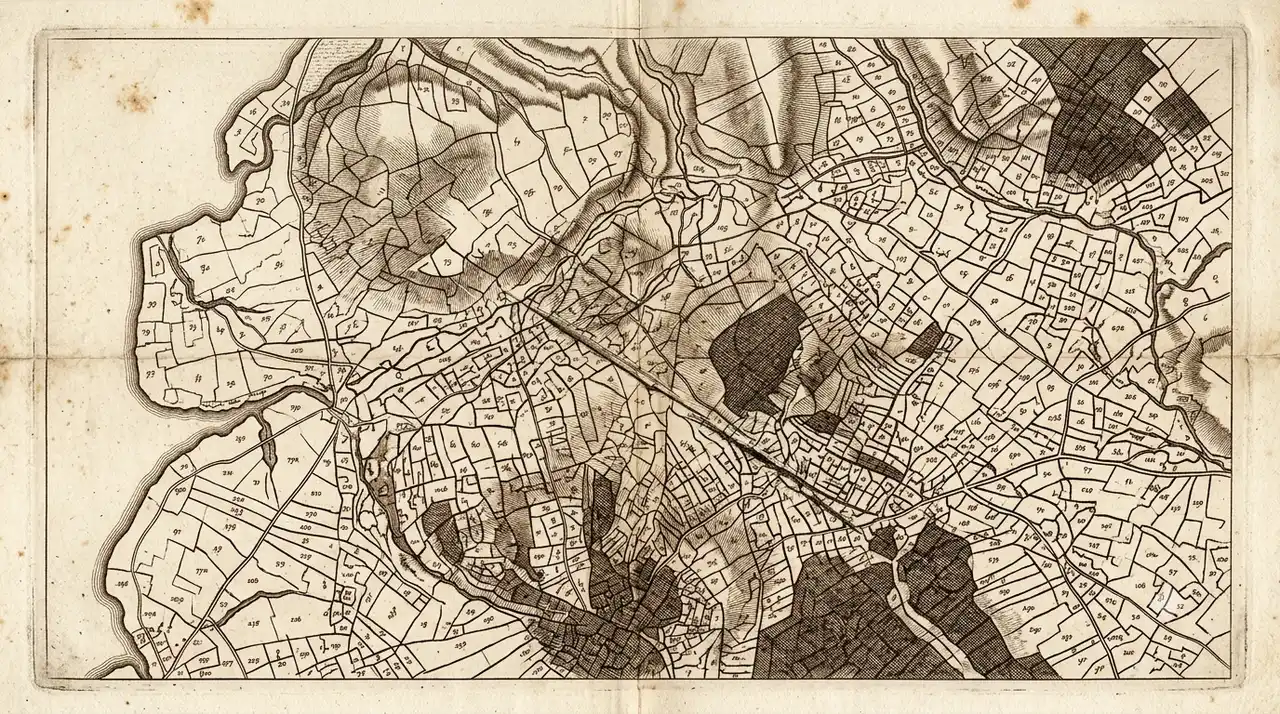 An old regional map scored into so many small numbered parcels that no single boundary line can be followed to its end